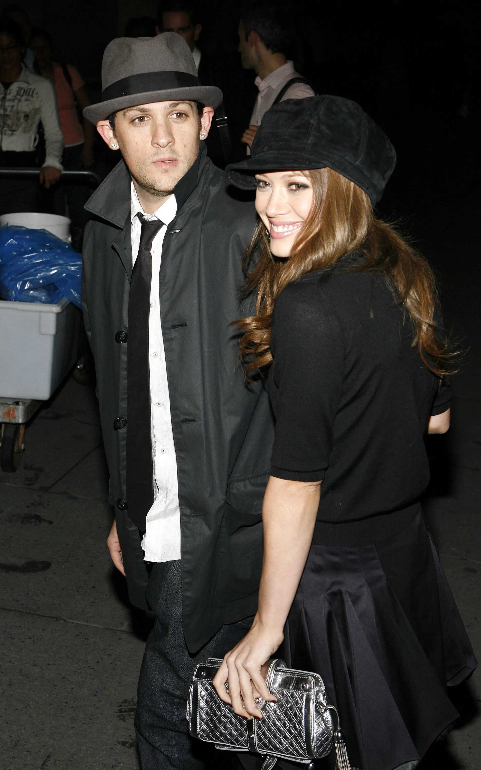 Joel Madden and Hilary Duff pose together.