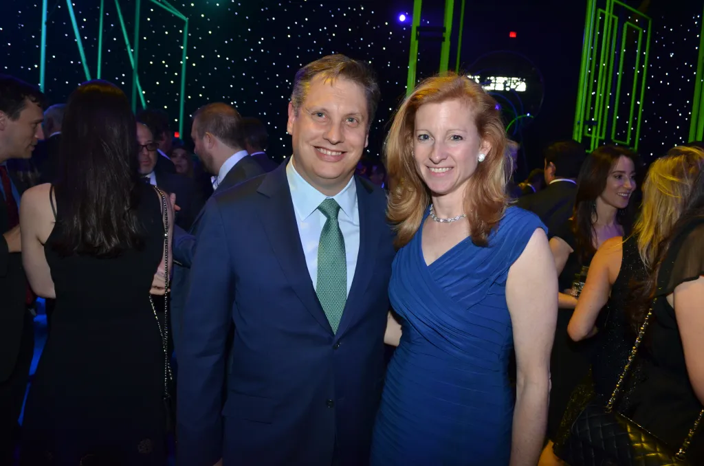 John and Laura Overdeck posing at The Robin Hood Foundation's 2016 Benefit.