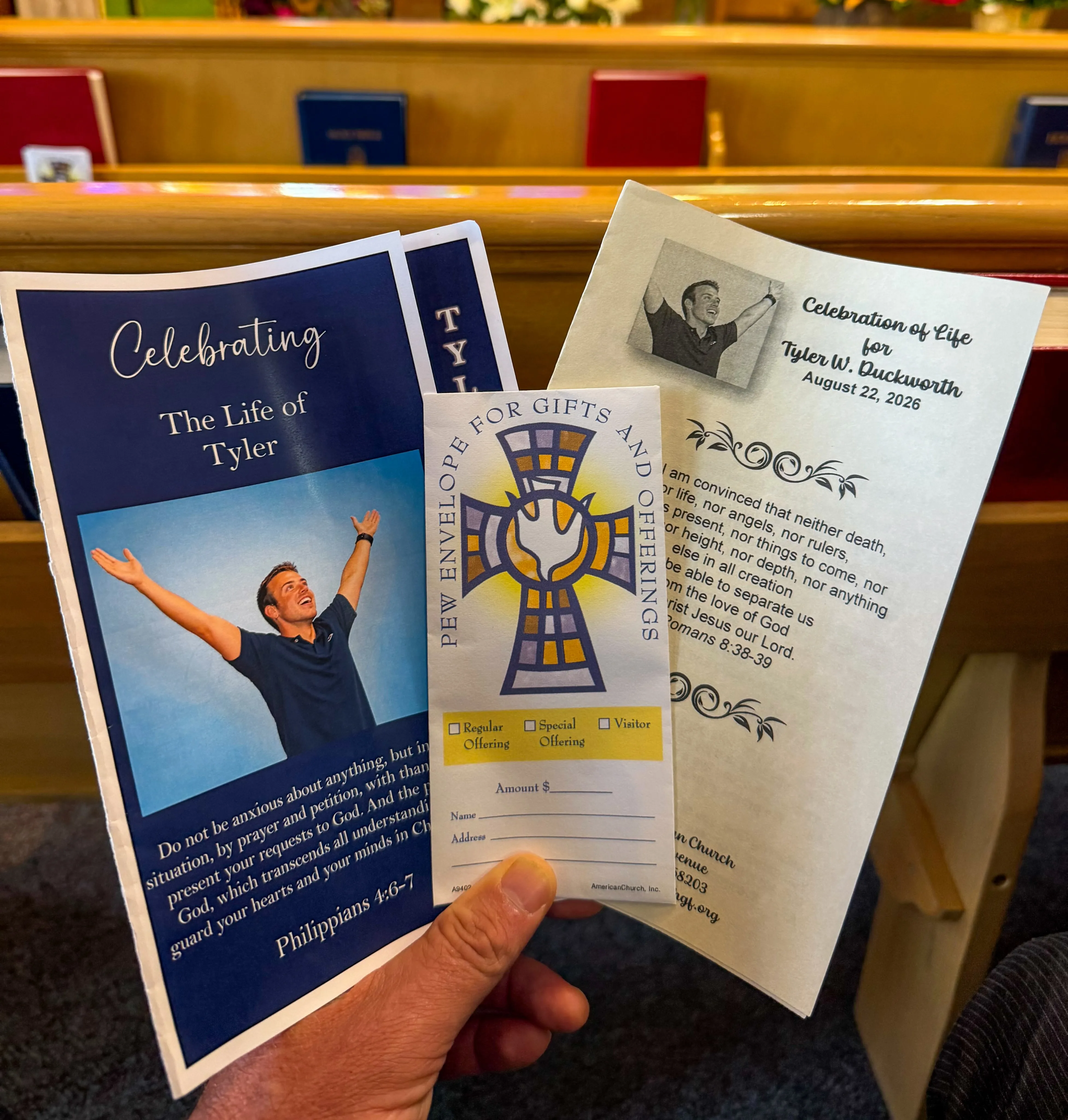 Funeral pamphlets for Tyler W. Duckworth and an envelope for church offerings.