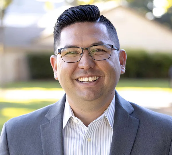California State Assembly member Josh Hoover smiling at the camera.