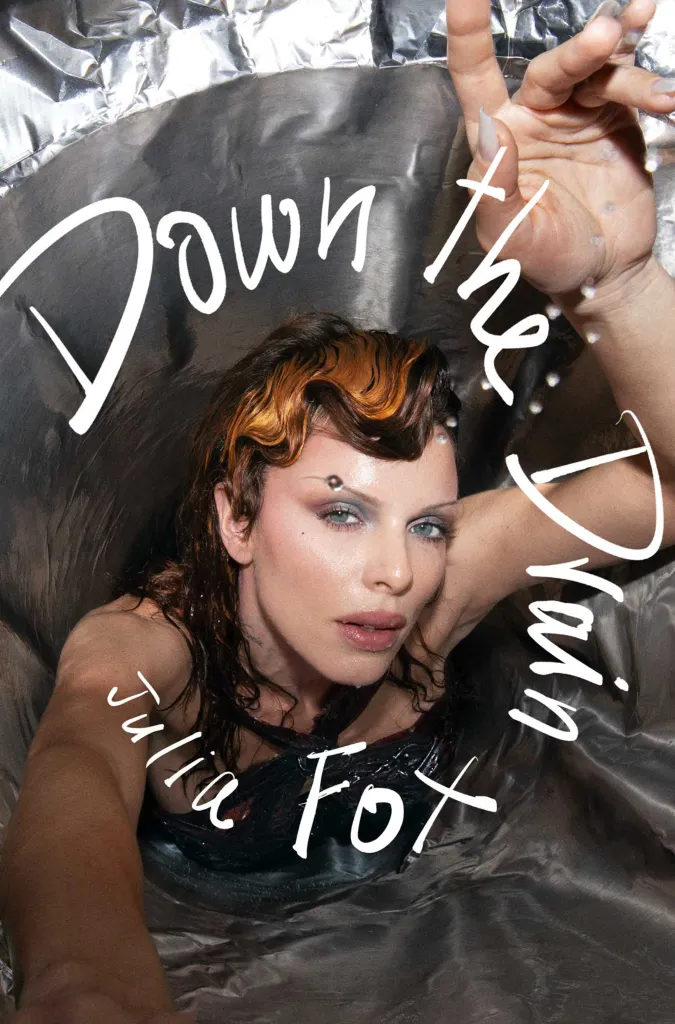 Julia Fox submerged in water with the words 