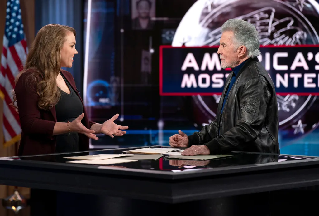Kara Robinson Chamberlain and John Walsh on the set of 