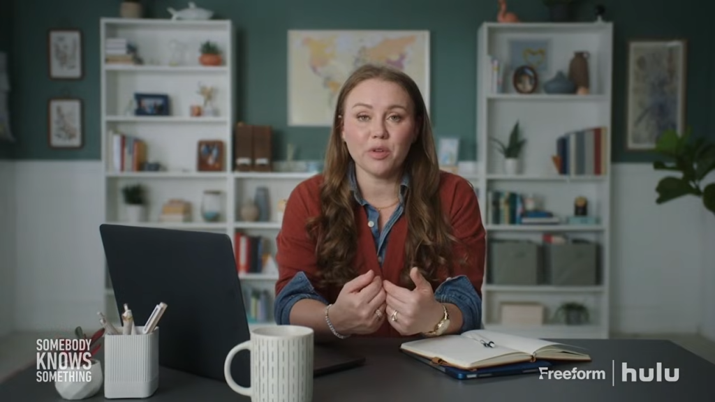 Kara Robinson Chamberlain speaks to the camera from a desk.