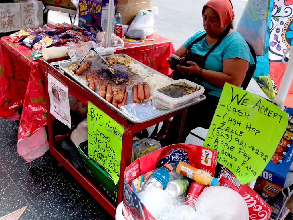 Street food vendors operating without permits on Hollywood Boulevard.