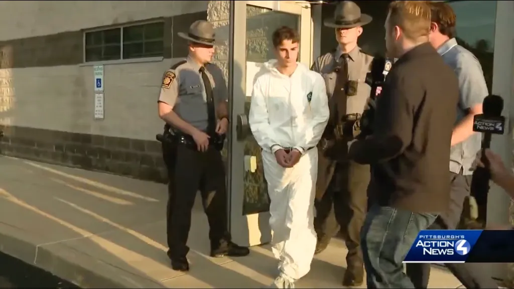 Royce Moser is walked out of the Pennsylvania State Troopers barracks after her arrest on Aug. 20, 2026.