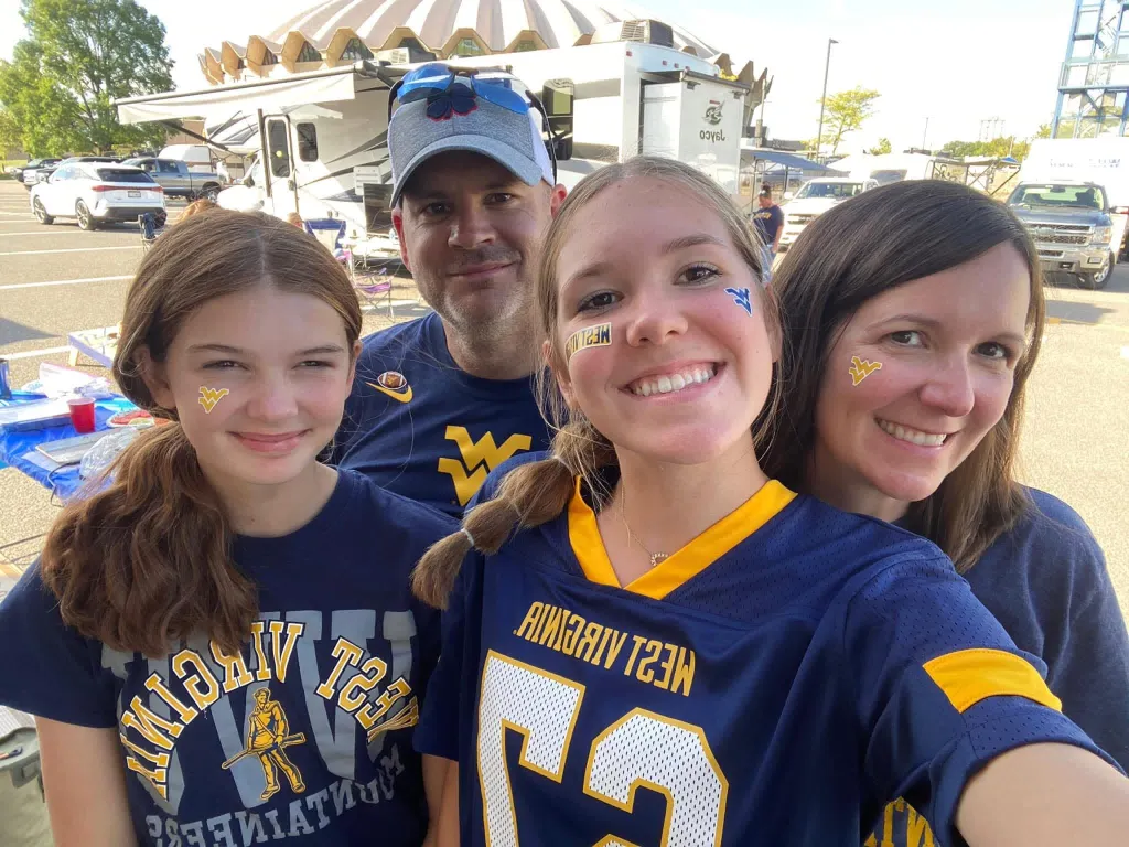Karoline Heintz with her family in an undated photo at West Virginia University football game.