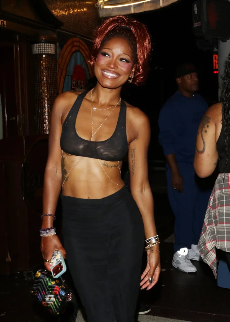 Keke Palmer smiling at a birthday celebration.