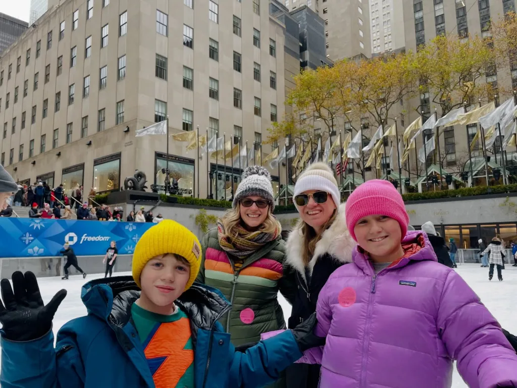 Kelly Clarkson and family ice skating in New York City.