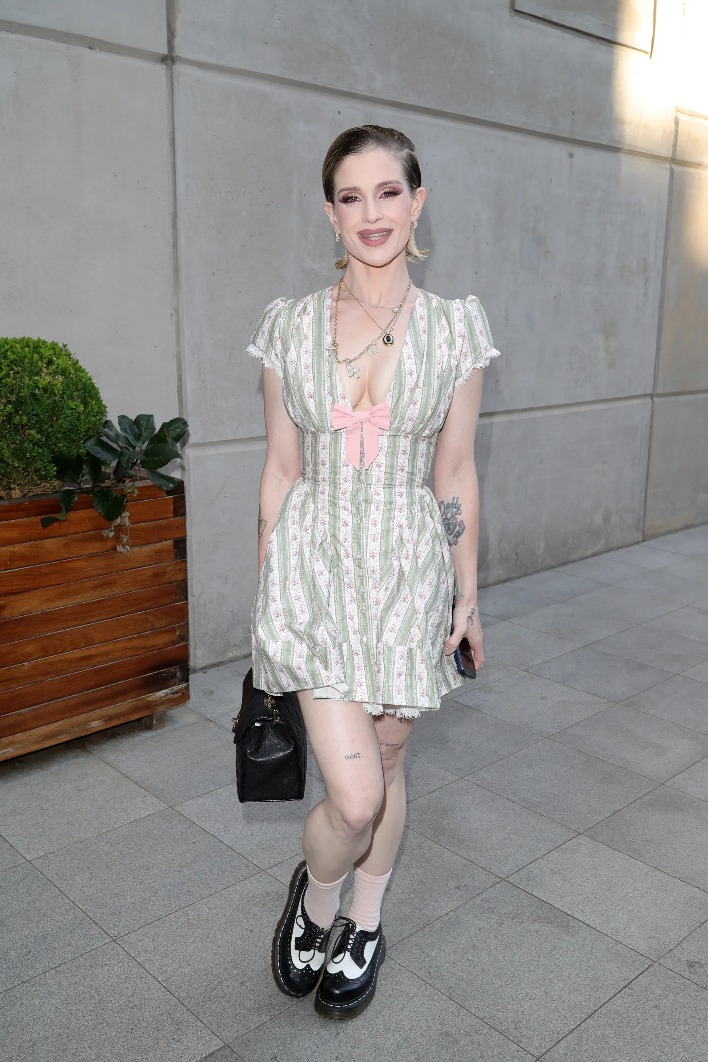 Kelly Osbourne posing at the Men's Mental Health art exhibition.