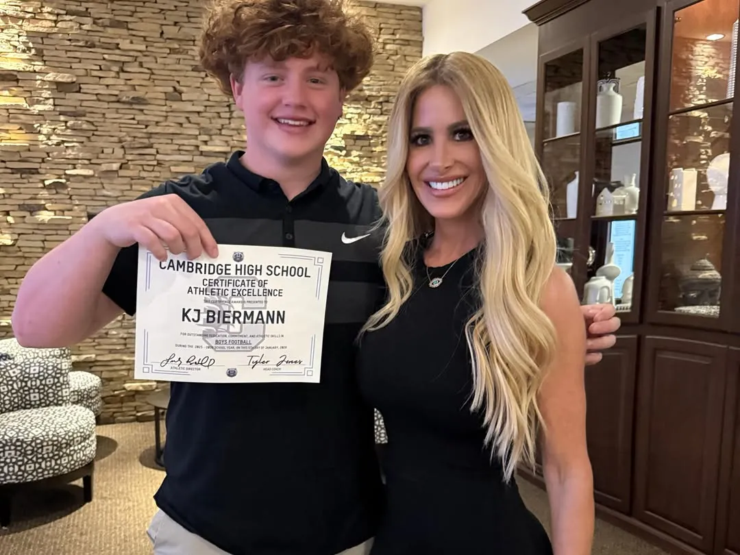 KJ Biermann and Kim Zolciak-Biermann posing with a 