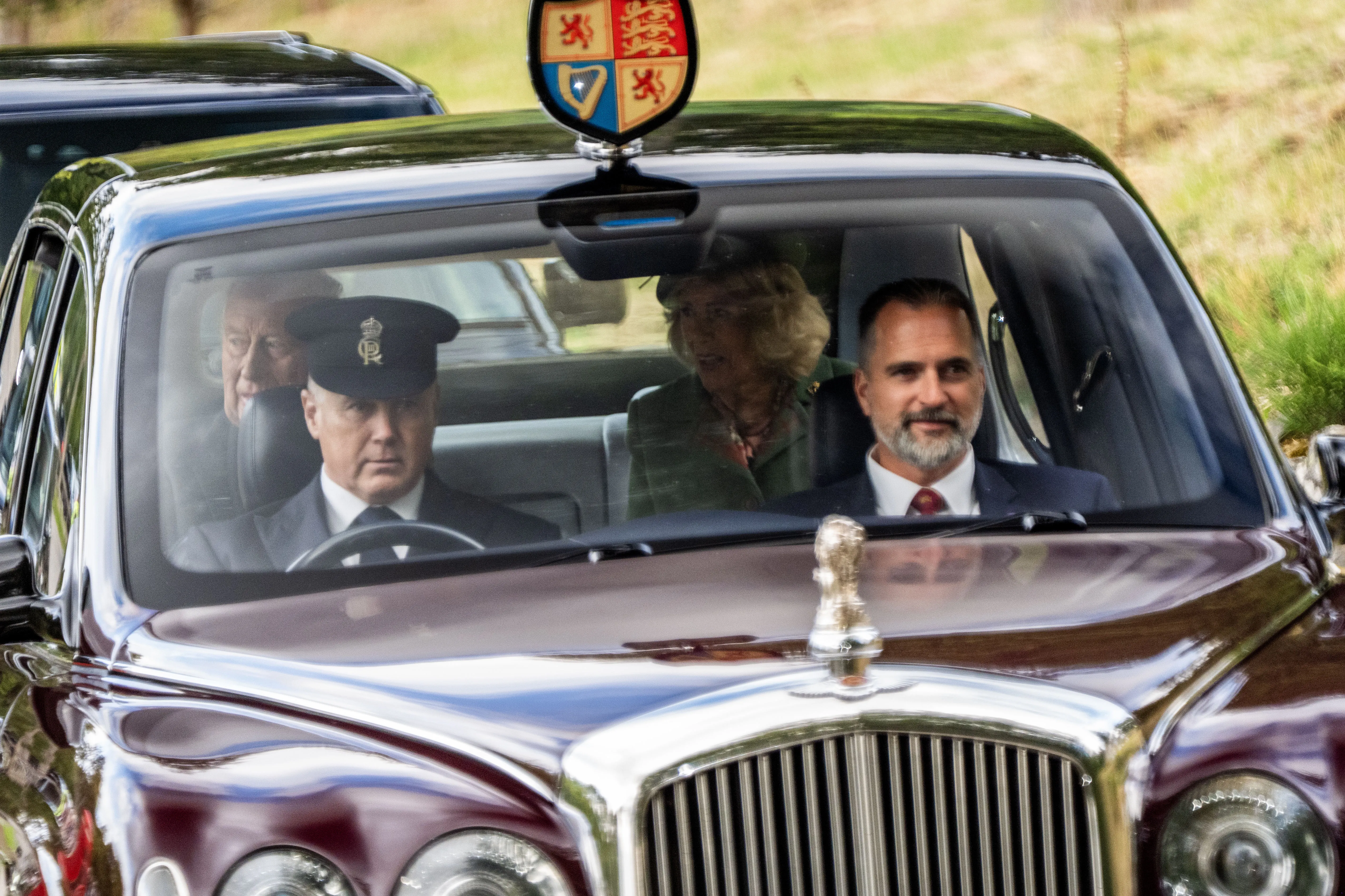 King Charles III and Queen Camilla arriving by car to attend a Sunday church service.