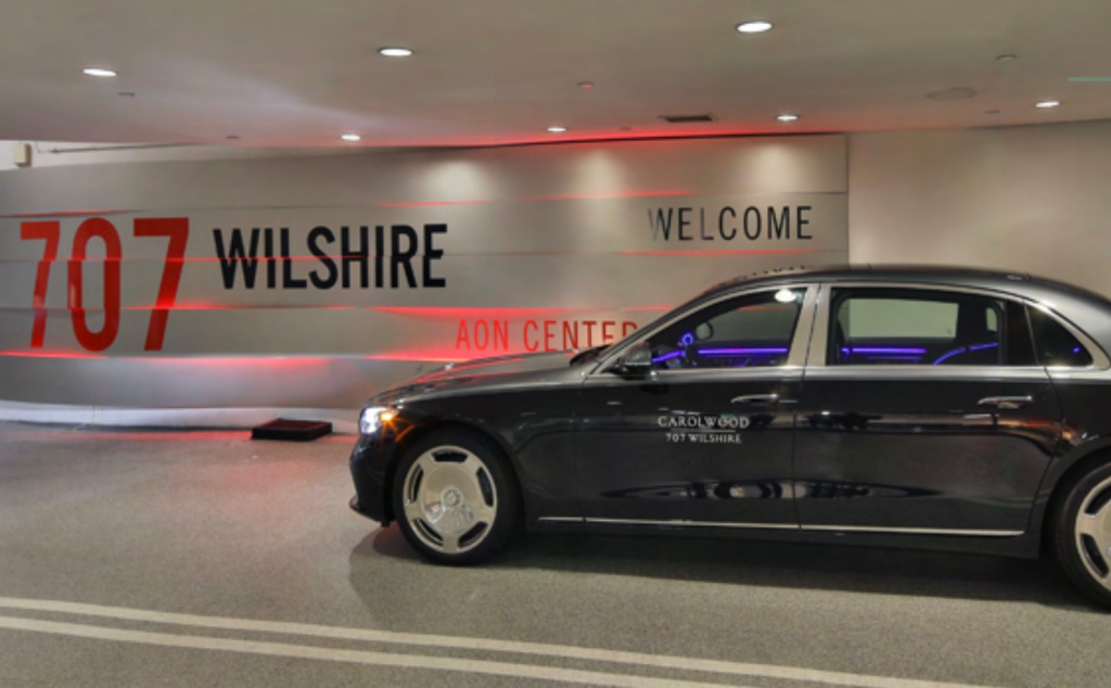 A black Maybach limousine parked in a garage with 