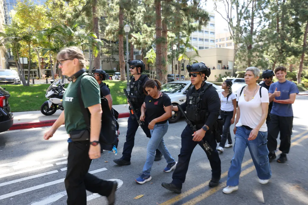 LAPD SWAT officers conduct a security drill with civilians at UCLA.