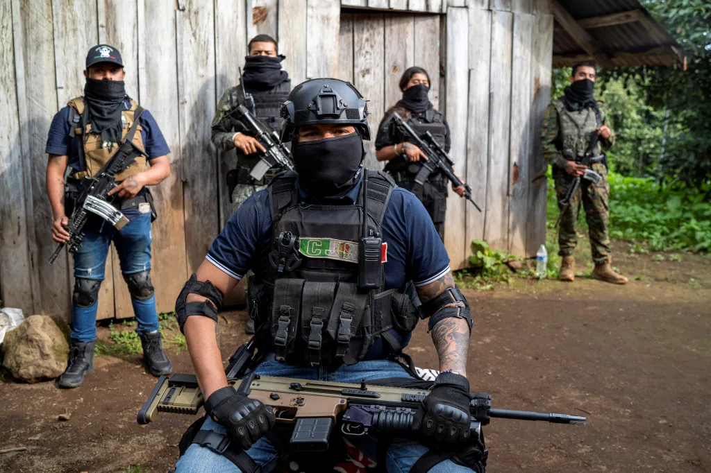 Members of the Jalisco New Generation Cartel (CJNG) pose with firearms at an undisclosed location in Mexico.