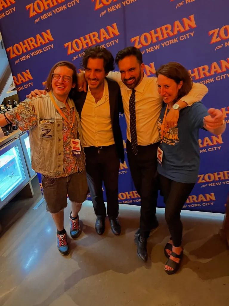 Donald Borenstein, Anthony Di Mieri, Zohran Mamdani, and Debbie Saslaw posing for a photo.