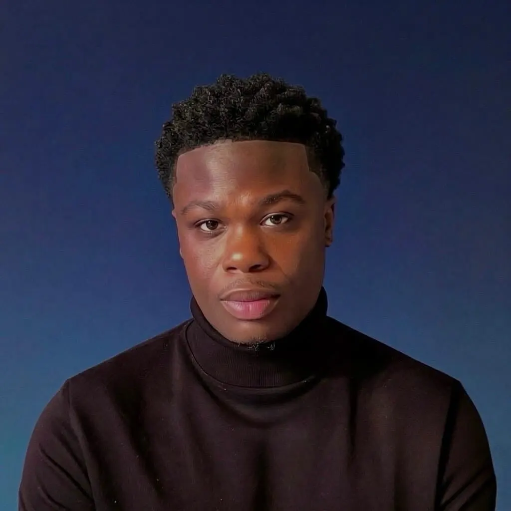 Kvontay Pringle, a young man with short, curly black hair and a black turtleneck.