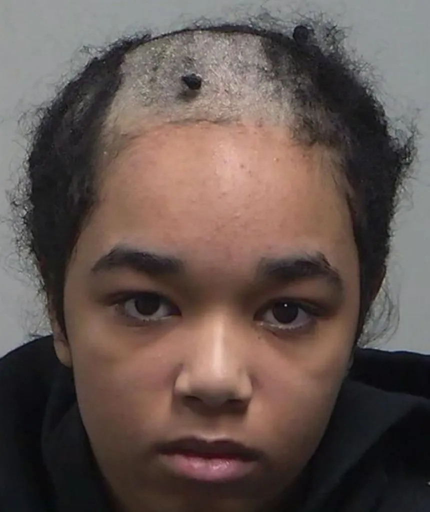 Lilyana Rose Wagne with shaved hair on top of her head.