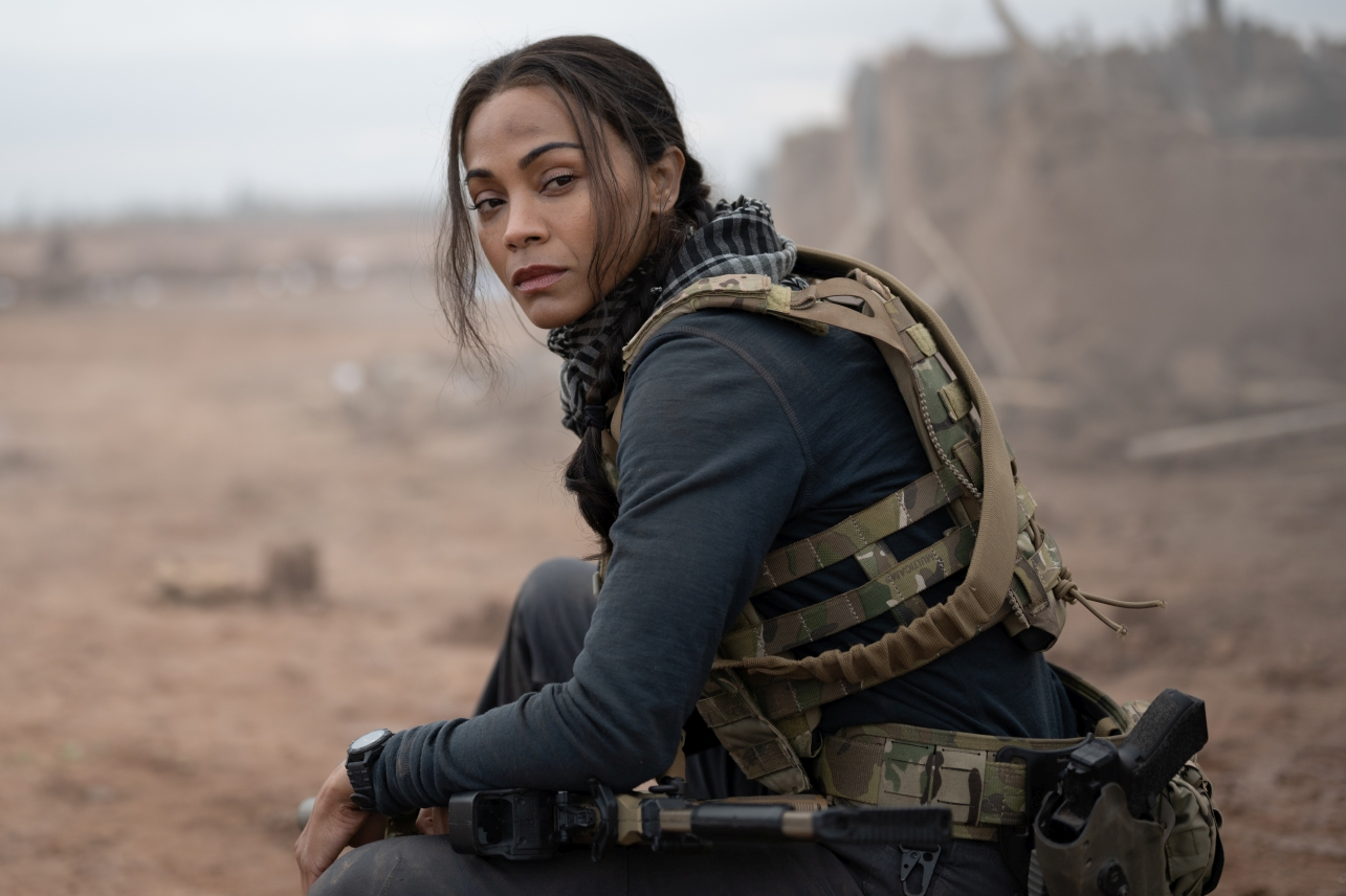 Zoe Saldaña says Taylor Sheridan gives actors two choices on his sets: accept the challenge or quit. The 
