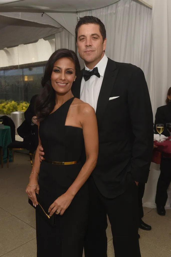 Liz Cho and Josh Elliott posing for a photo.