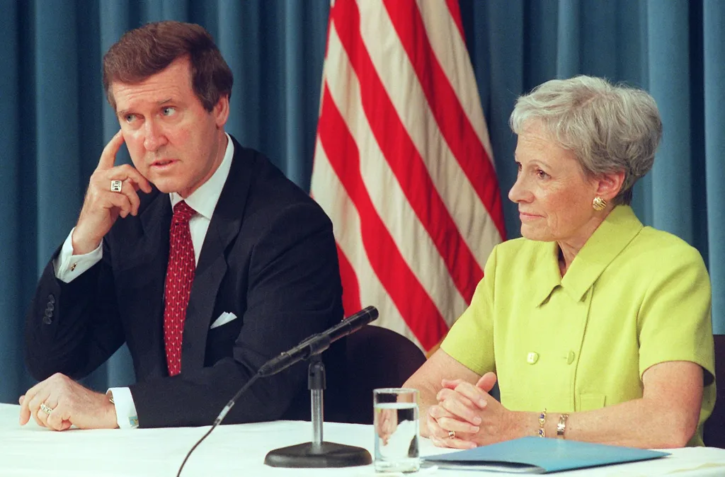 Defense Secretary William Cohen speaking to reporters as former Senator Nancy Kassebaum Baker looks on.