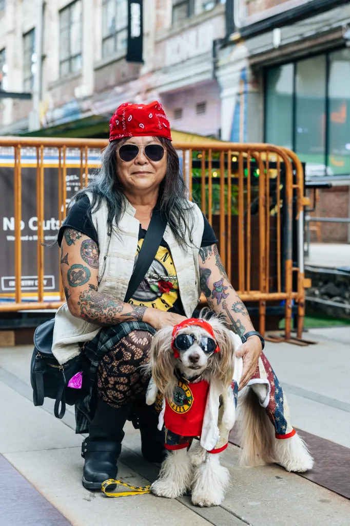 Loraine Gates and her dog Jojo, dressed in a red bandana and sunglasses, attend the Dogfish Head Look-a-Like contest.