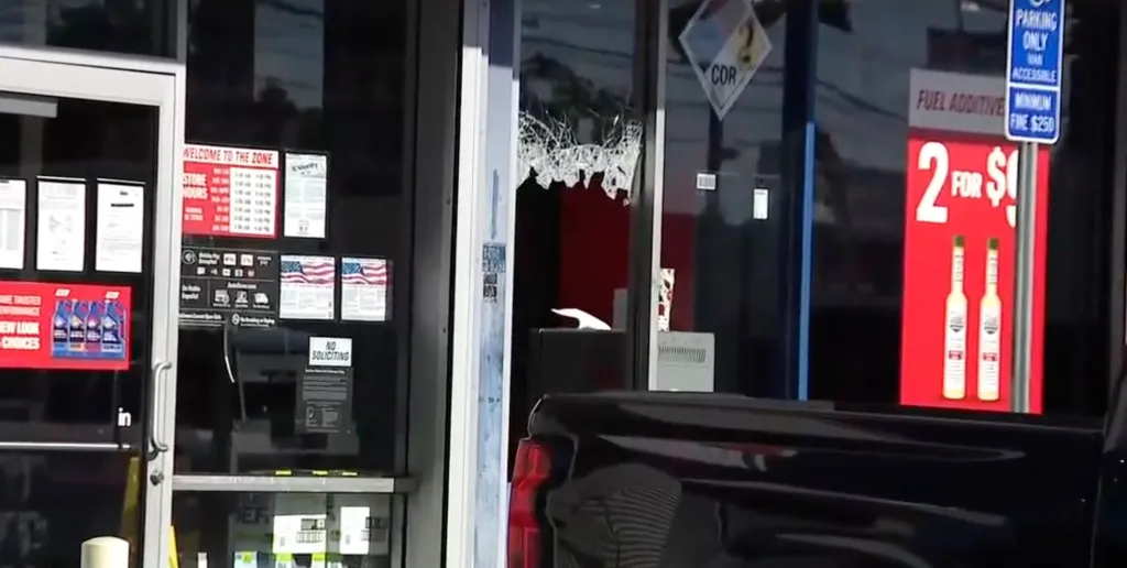 The shattered glass door of an AutoZone store in South Los Angeles.