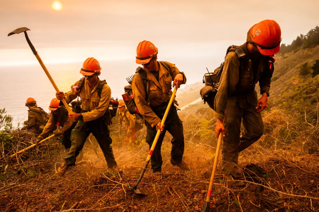 Los Padres Hotshots clear brush as the Plaskett Fire burns in Big Sur, Calif.