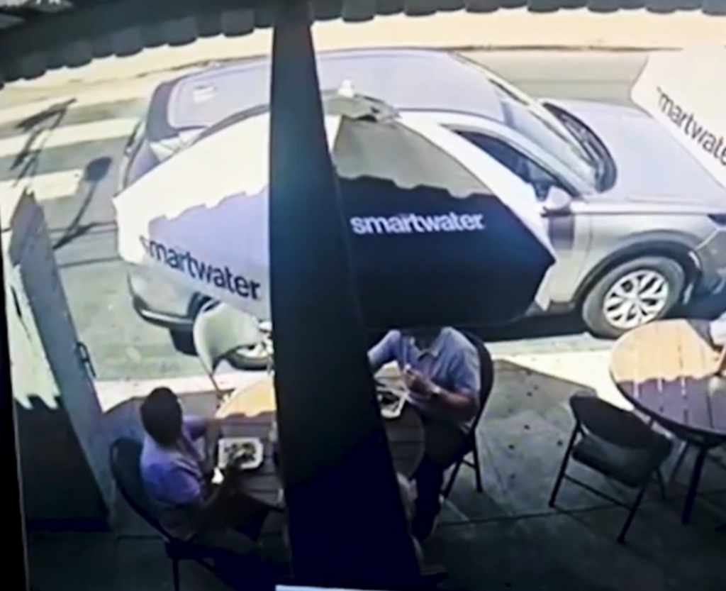 Surveillance footage shows a grey SUV with 