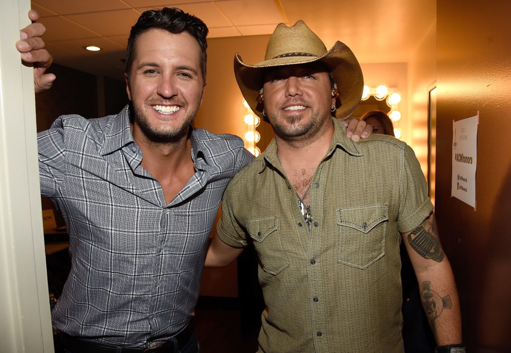 Luke Bryan and Jason Aldean posing backstage.