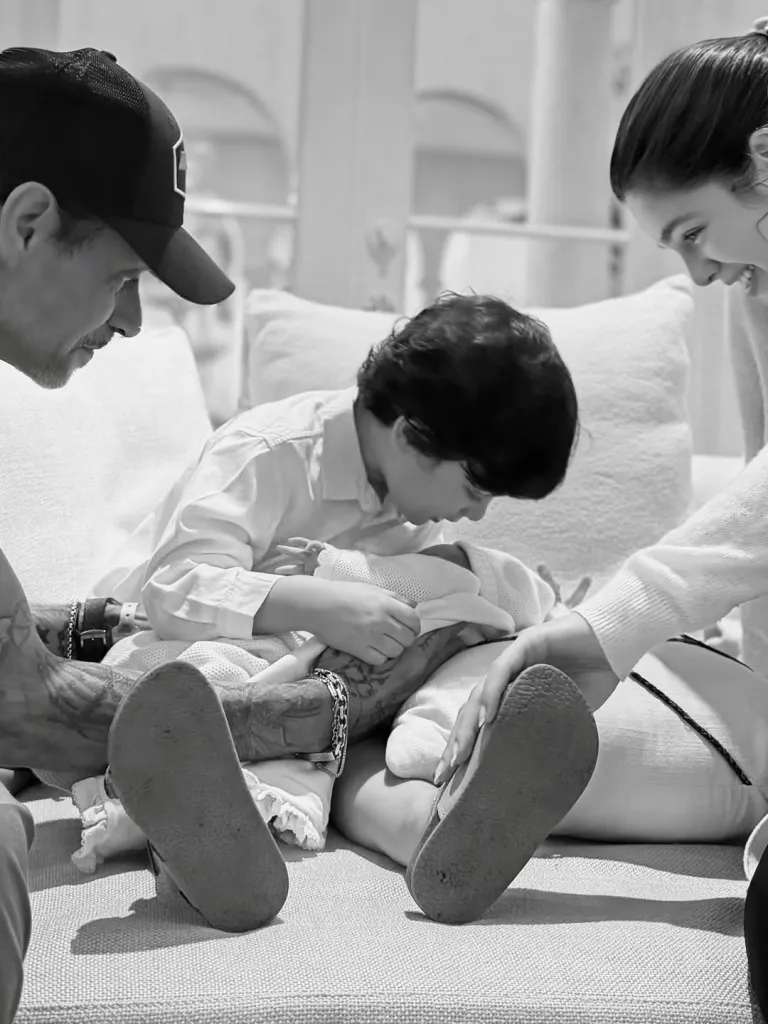Marc Anthony and Nadia Ferreira with their new baby.