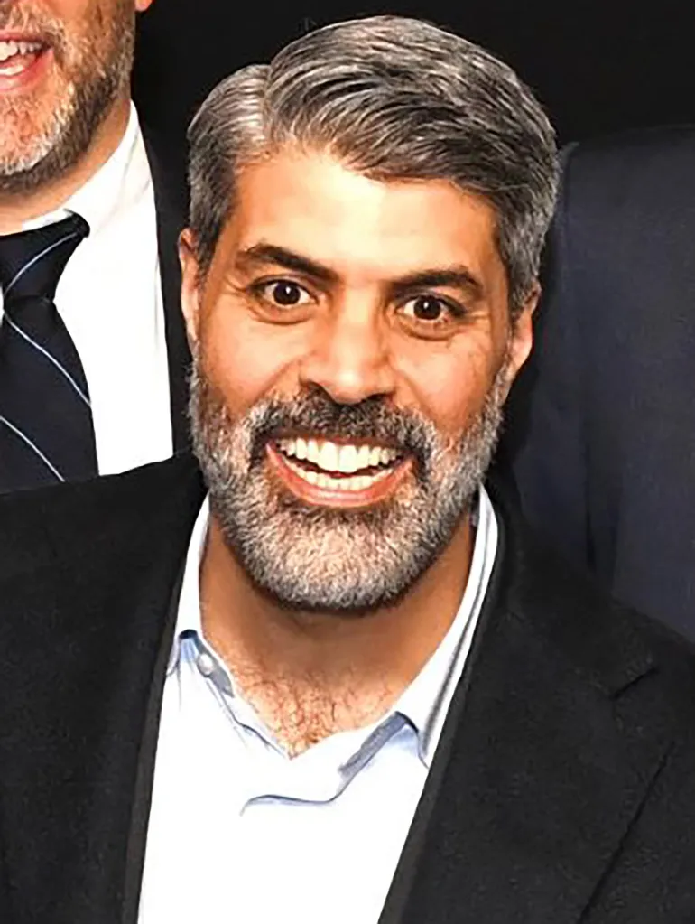 Basil Qunibi, CEO of Atom, smiling.