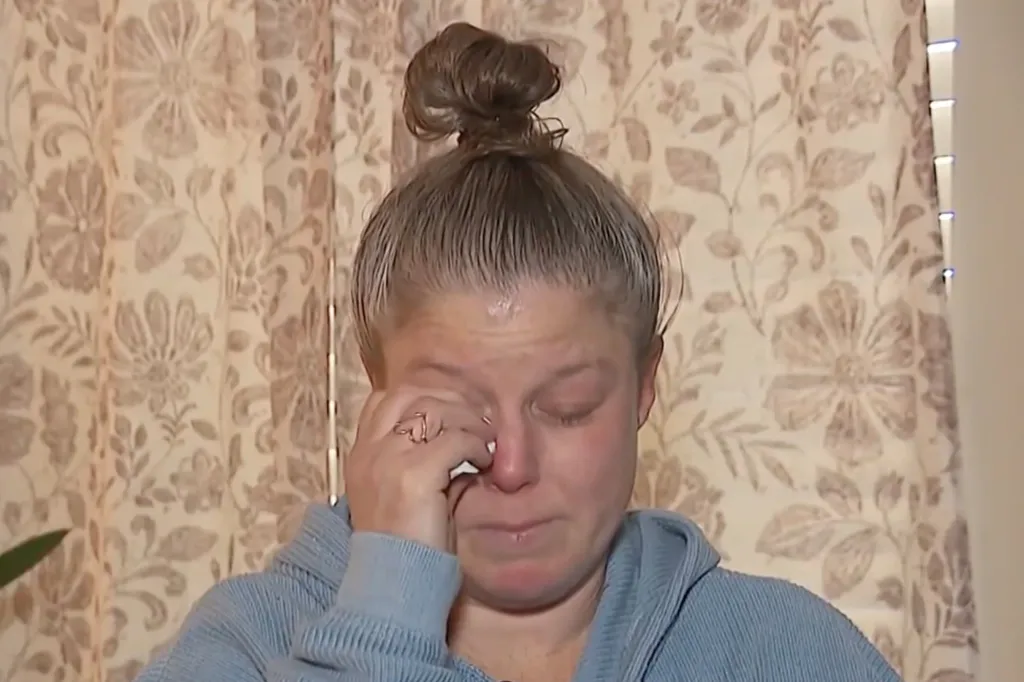 Megan DeLand, Isabell's mother, wiping tears from her eyes.