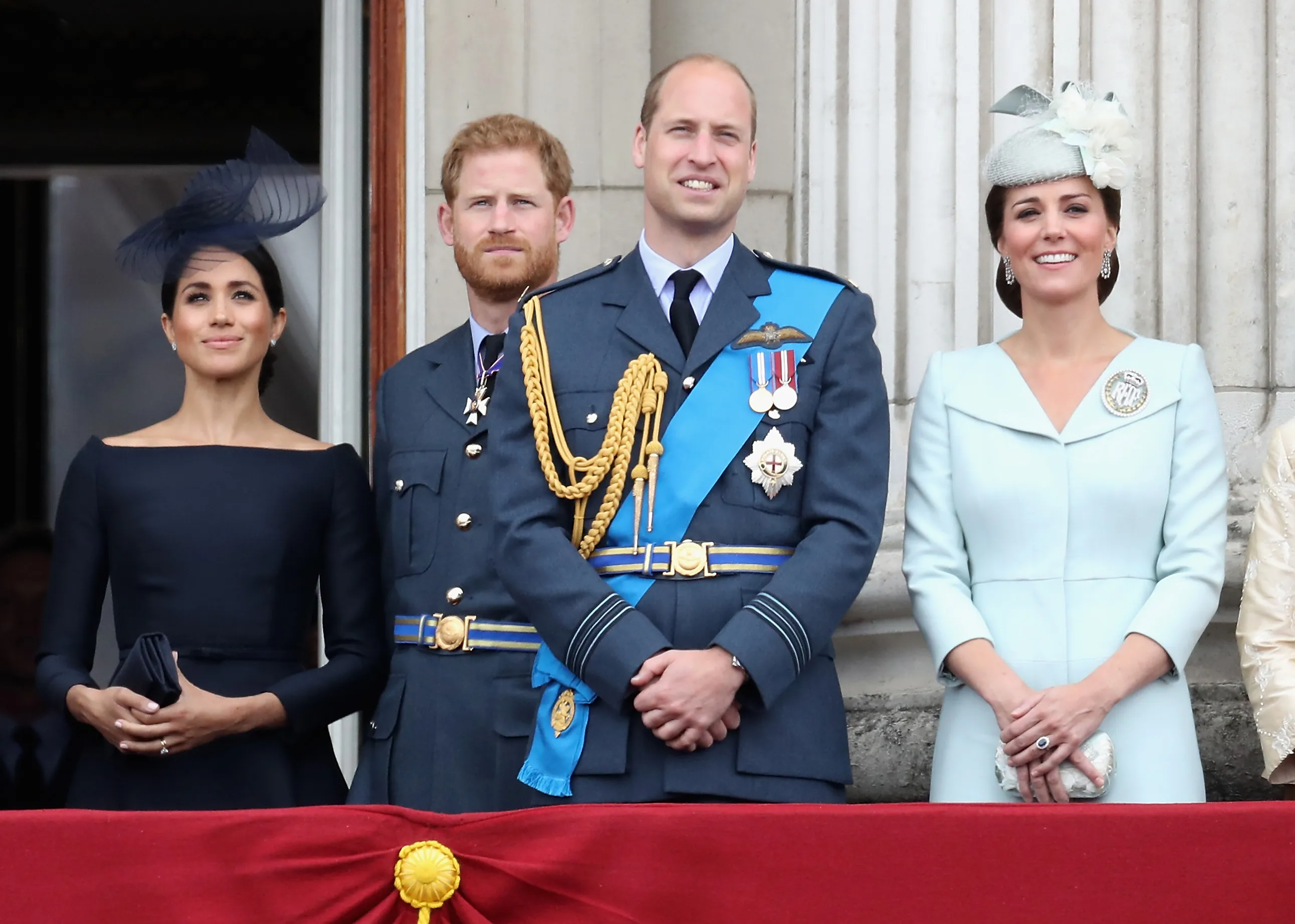 Meghan, Duchess of Sussex, Prince Harry, Duke of Sussex, Prince William, Duke of Cambridge, and Catherine, Duchess of Cambridge, on the balcony of Buckingham Palace.
