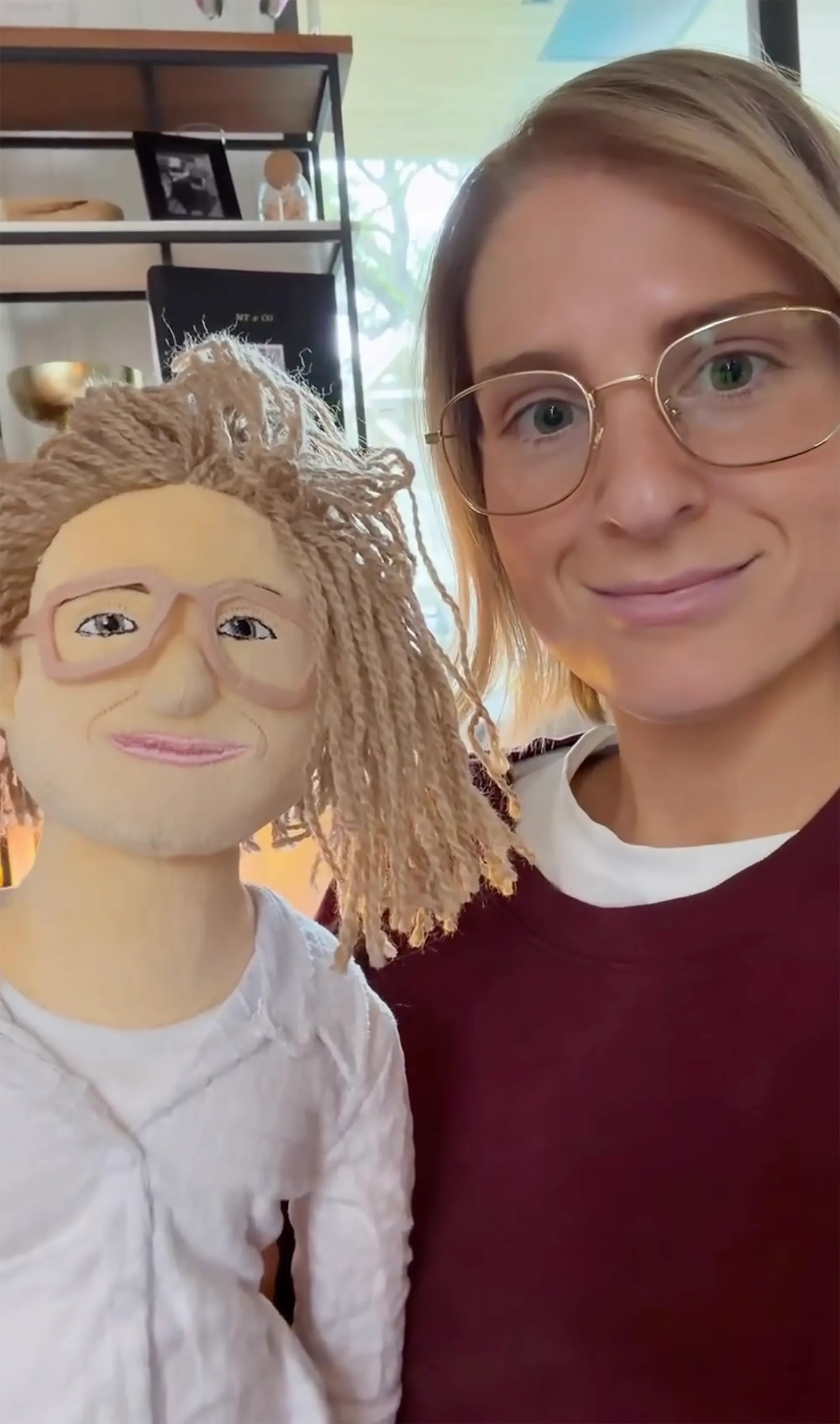 Meghan Trainor posing with a look-alike doll.