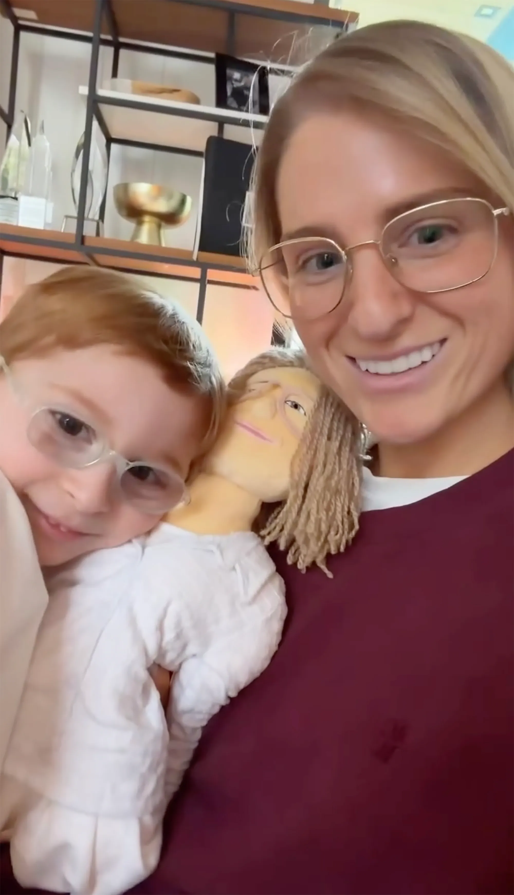 Meghan Trainor, her son Riley, and a doll designed to look like Trainor.