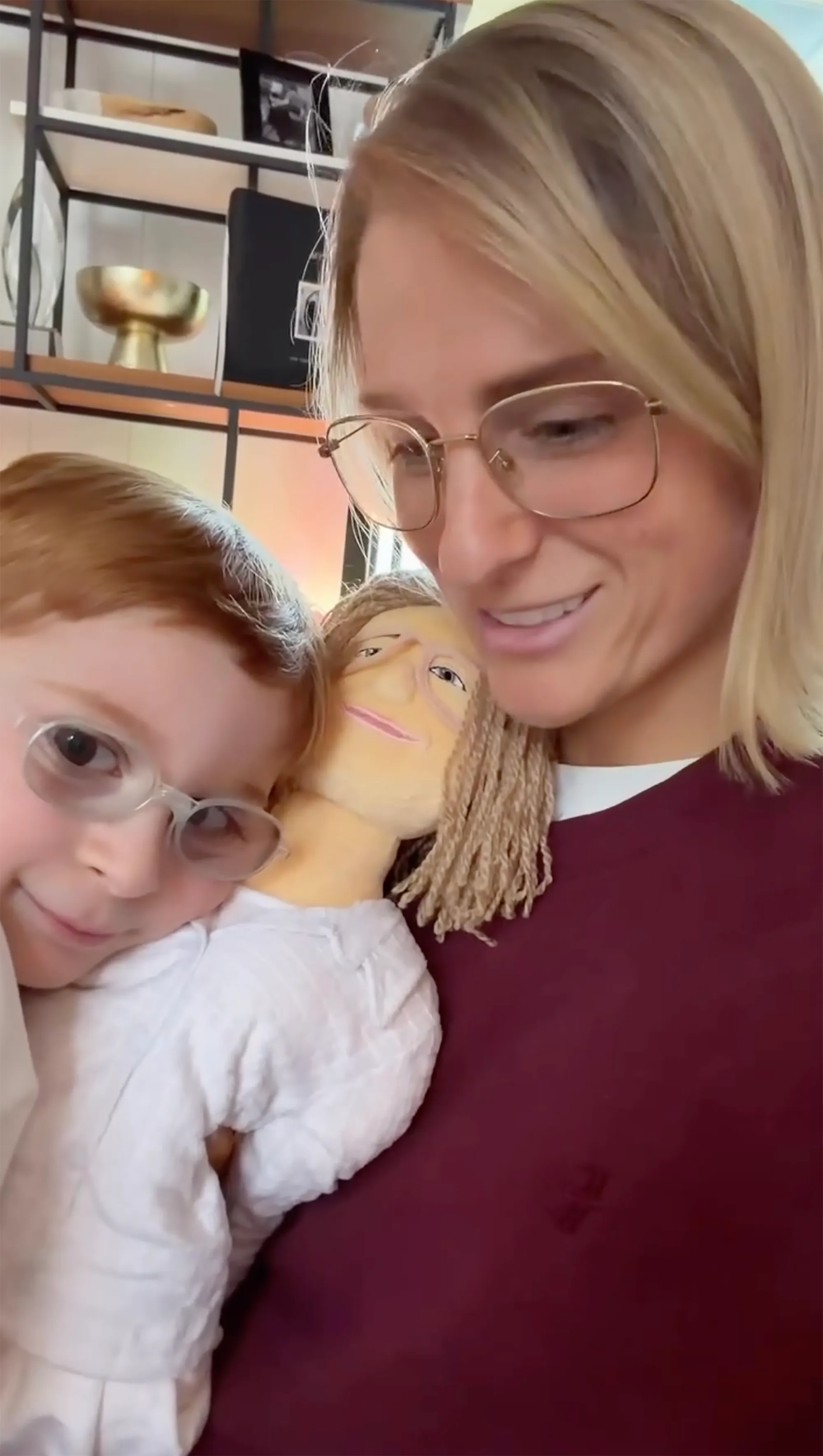 Meghan Trainor and her son Riley with a doll created in her likeness.