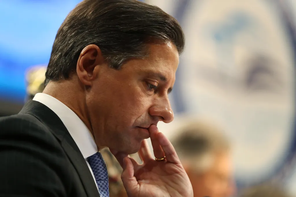 Miami-Dade Schools Superintendent Alberto Carvalho looking down, with his finger to his mouth, while announcing he will turn down a job offer.