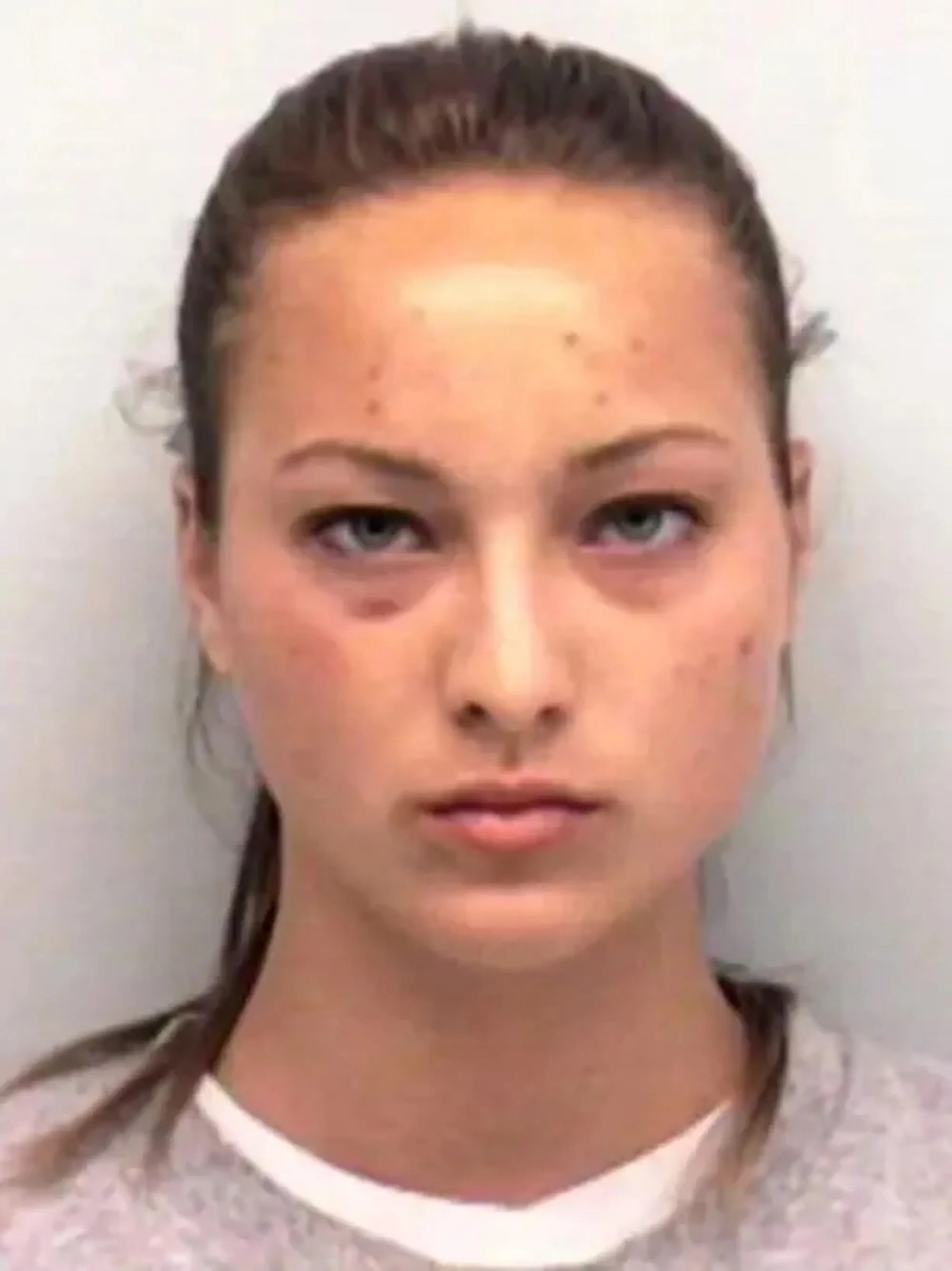 Kayla Quick mugshot with dark circles under her eyes.