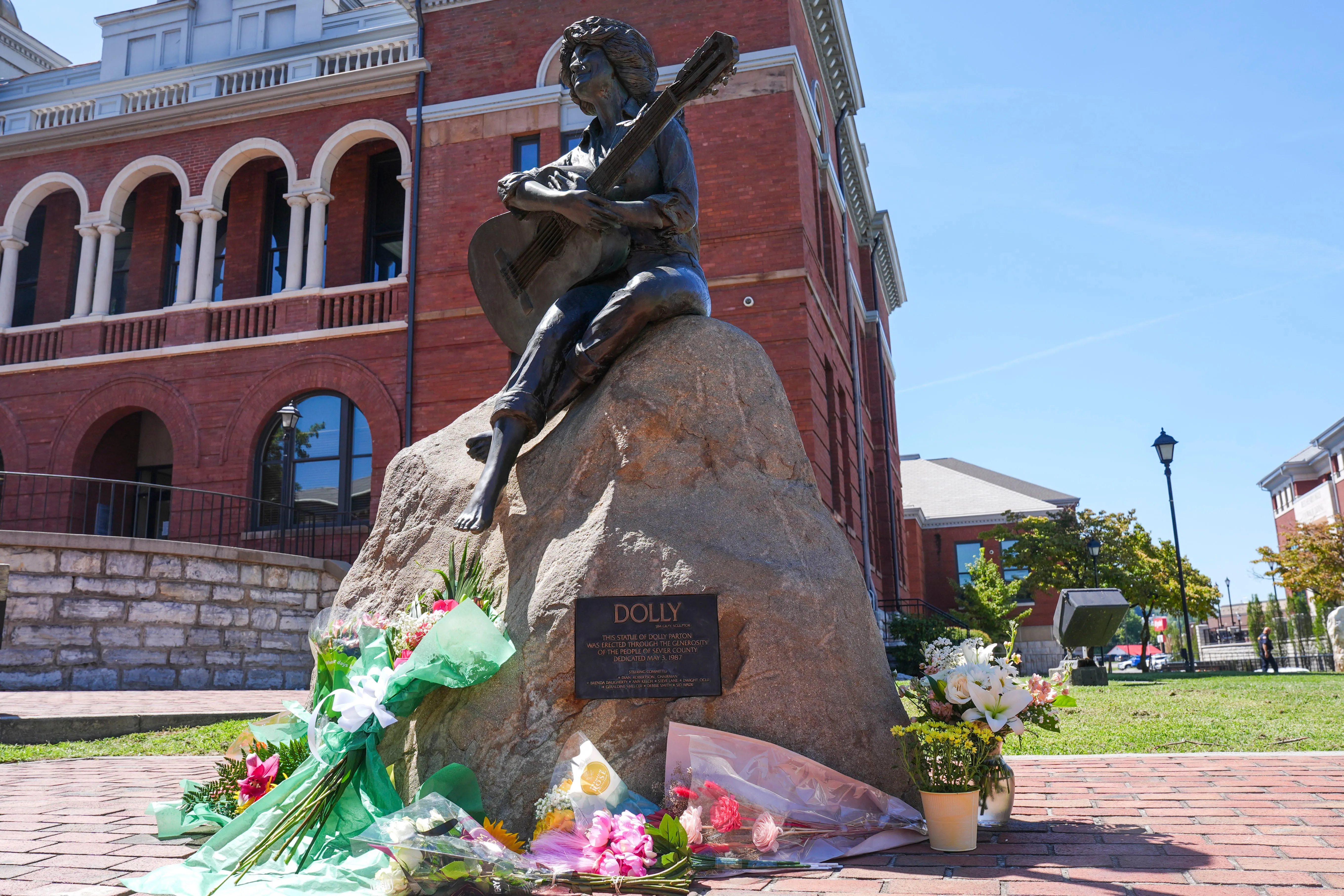 Mourners pay their respects to Dolly Parton after the announcement of her passing at the Dolly Parton Statue