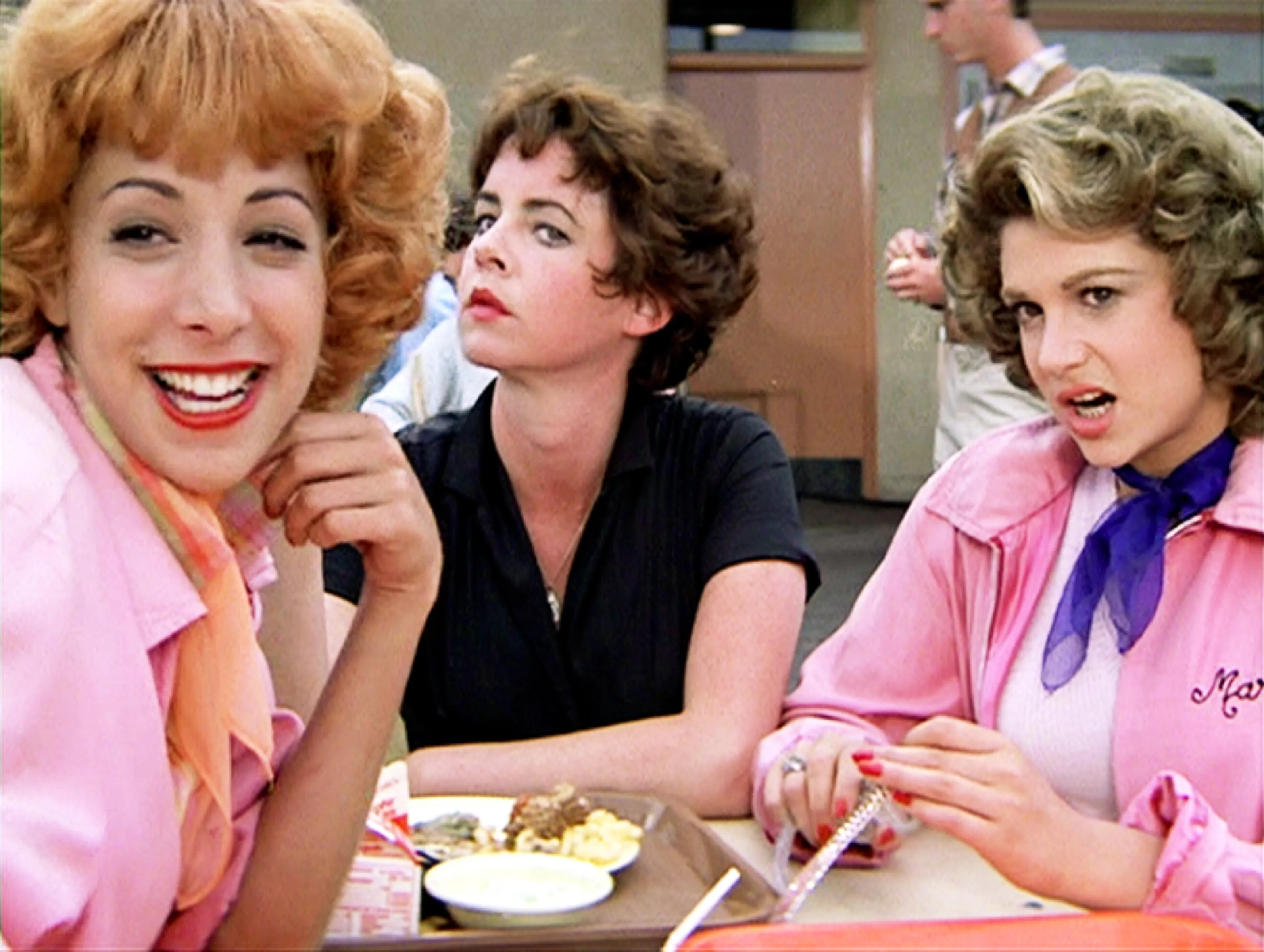 The Pink Ladies from Grease: Frenchy, Rizzo, and Marty Maraschino.