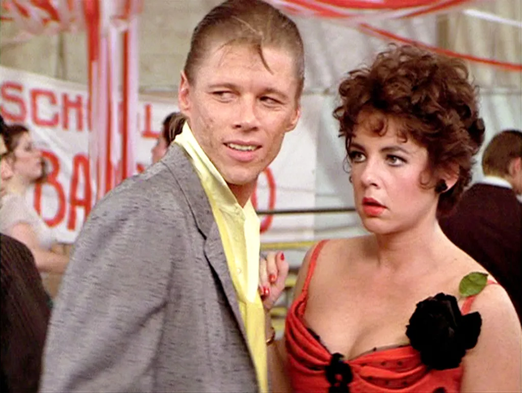 Dennis Stewart as Leo and Stockard Channing as Rizzo in the movie