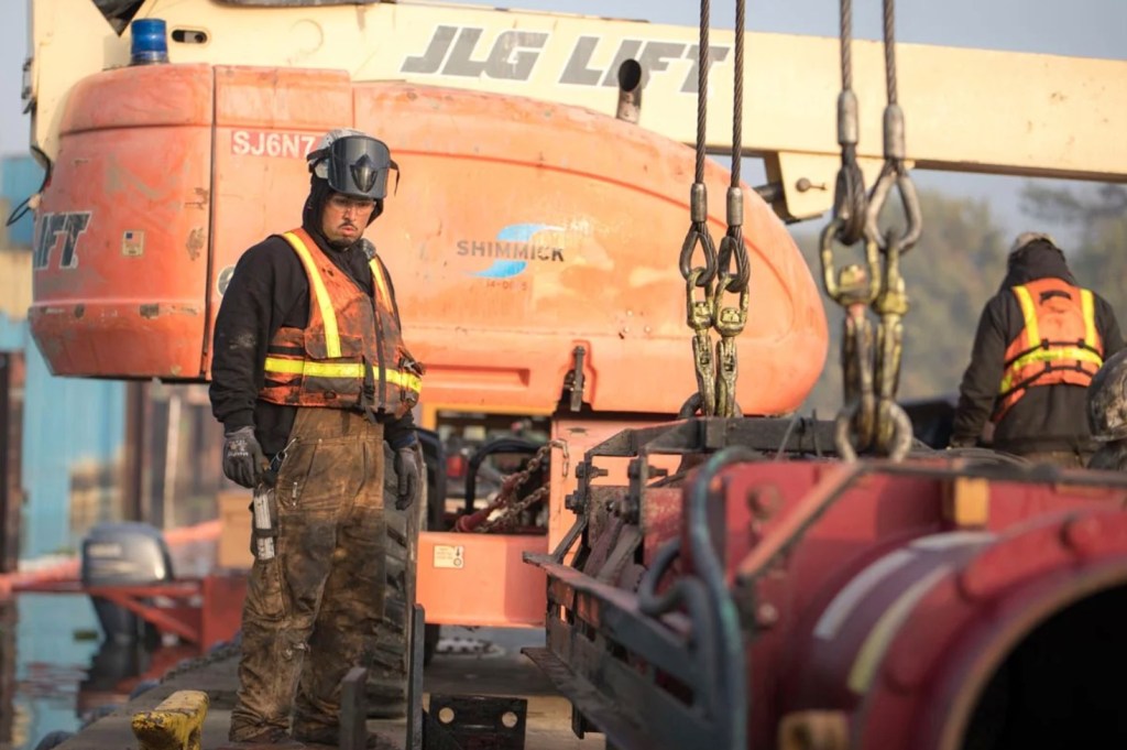 Union workers operating heavy machinery.