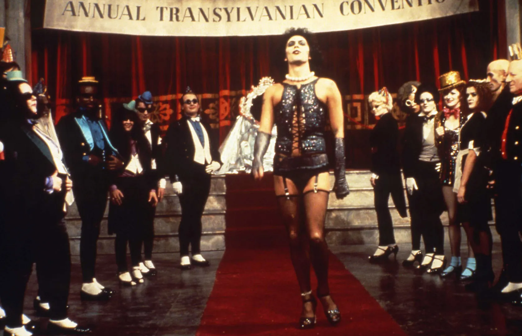 THE ROCKY HORROR PICTURE SHOW, Tim Curry (center), Nell Campbell (right, gold top hat), Patricia Quinn (maid's uniform), Richard O'Brien (bald, second from right), 1975. TM & Copyright ©20th Century Fox. All rights reserved./courtesy Everett Collection
THE ROCKY HORROR PICTURE SHOW, Tim Curry (center), Nell Campbell (right, gold top hat), Patricia Qui