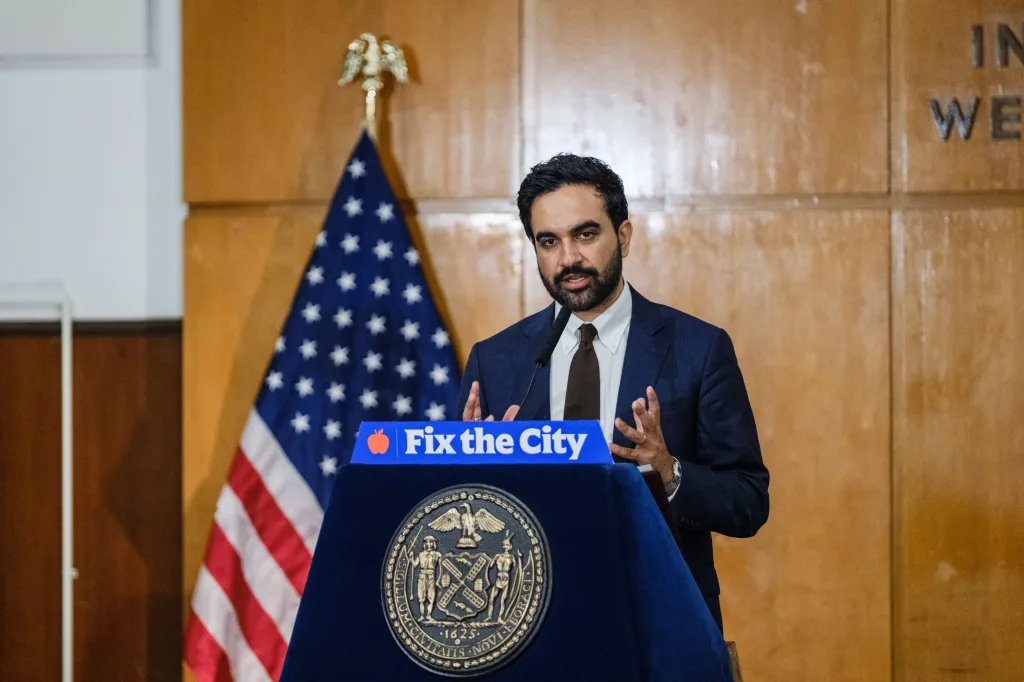 New York City Mayor Zohran Mamdani speaks at a podium with a 