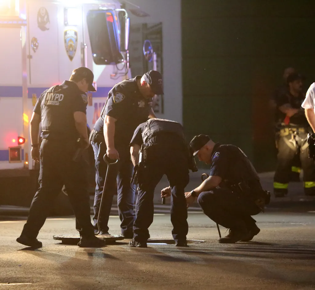 New York City Police Emergency Service officers conduct an unknown operation examining a manhole on May 29, 2026, at Bedord Avenue and Lynch Street in the Williamsburg section of Brooklyn.