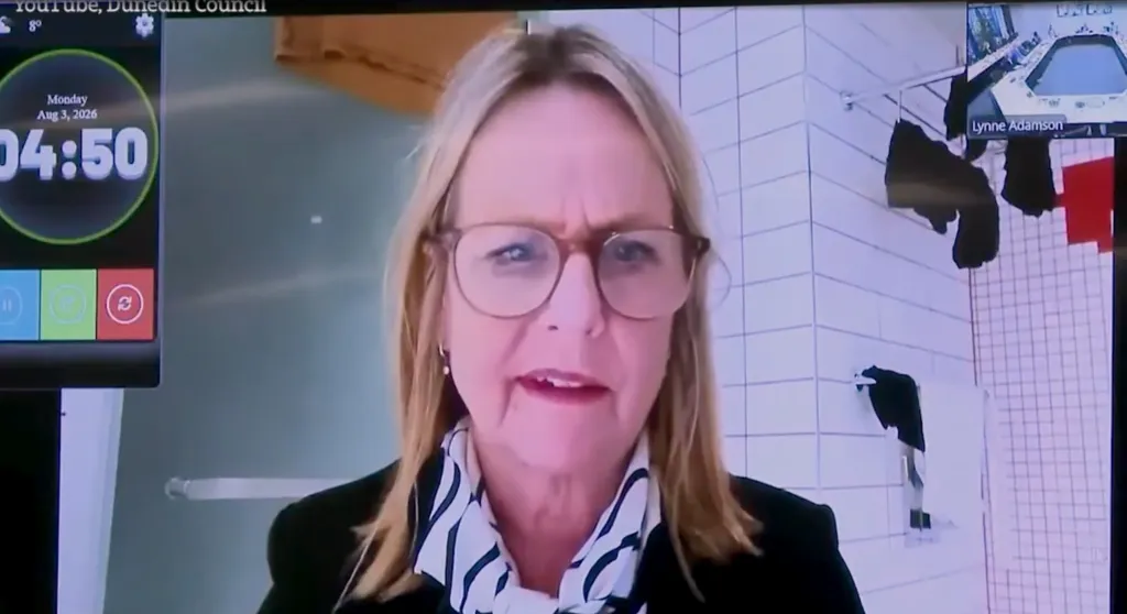 New Zealand politician Jo Galer attending a city council meeting from a bathroom.