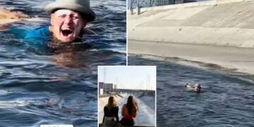 Bizarre moment woman caught casually floating down notorious LA River