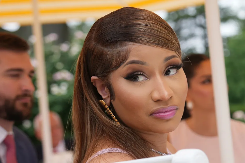 Nicki Minaj listening to President Donald Trump speak in the White House Rose Garden.