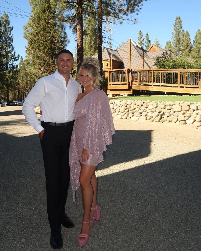 Nicole Franzel and Victor Arroyo posing outside.