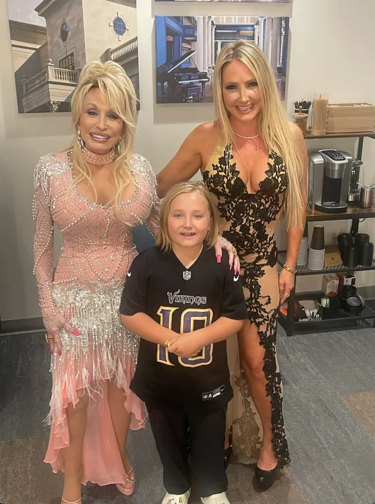 Dolly Parton, Nikki, and Nikki's son Hendrix pose for a photo.